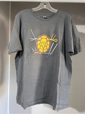 Men's Black Short-Sleeve Graphic Tee with Yellow Turtle Emblem